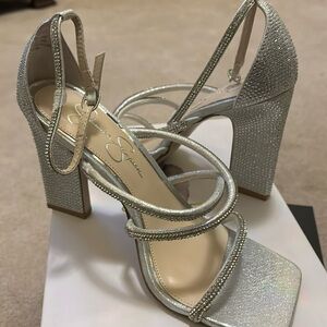 Brand new Jessica Simpson “Geralie” silver shimmer heels.